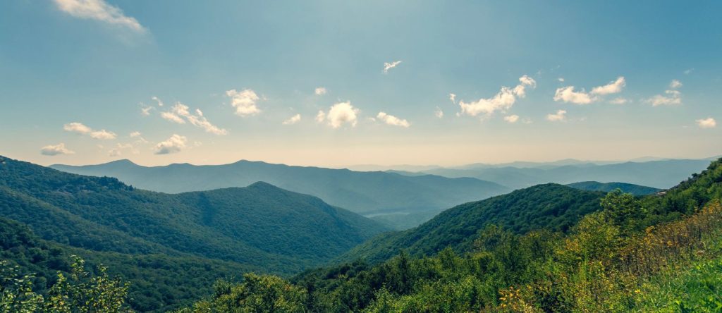 Appalachian mountain ridges under a blue sky