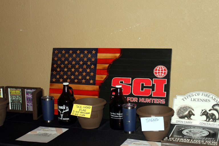 SCI-branded raffle prizes, including a wooden flag and drinkware