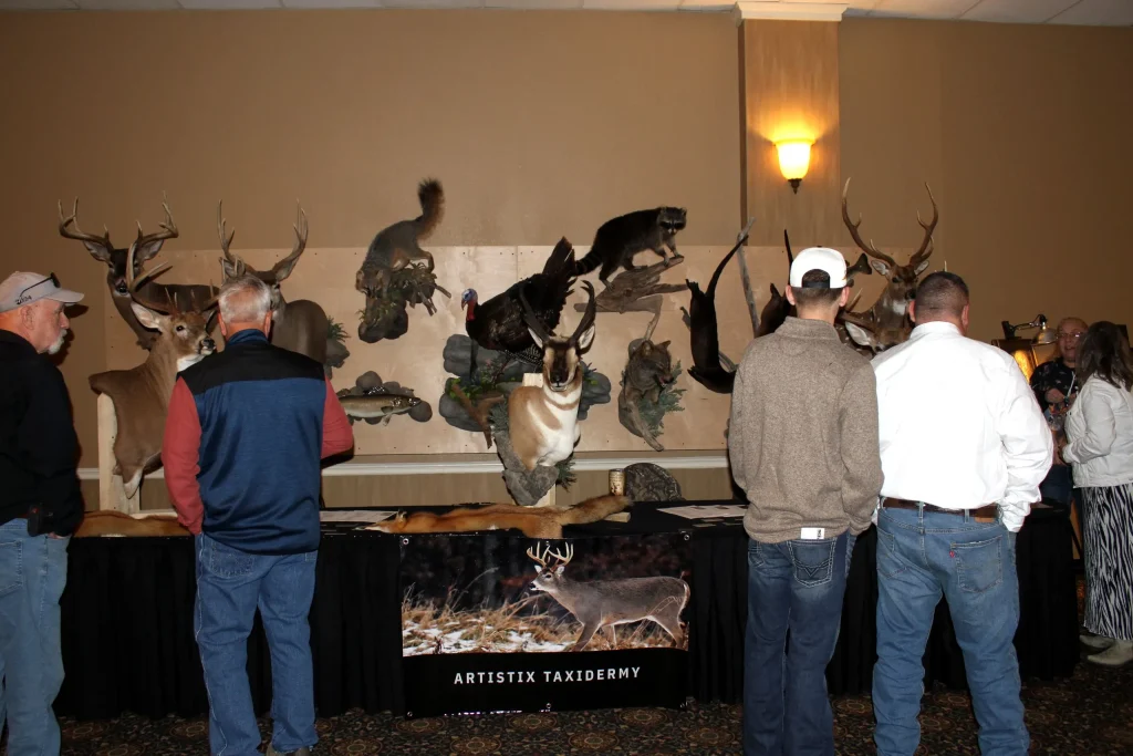 Guests viewing wildlife mounts at the chapter’s Night of the Hunter dinner