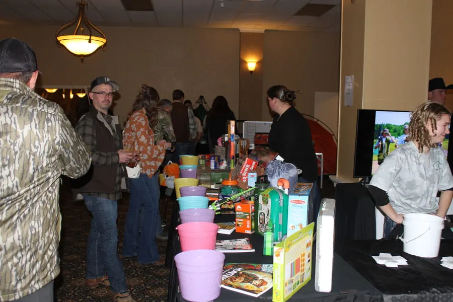 Guests browsing the raffle tables at the chapter fundraiser